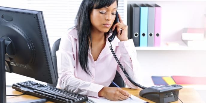 woman conducting phone interview