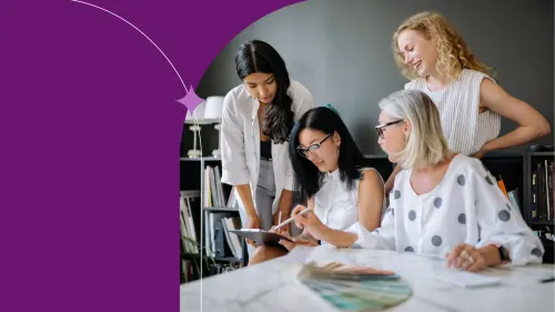 Diverse professional women collaborating in a supportive modern workplace.