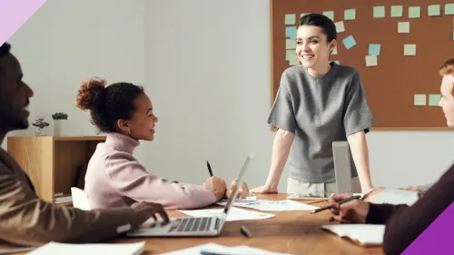 A young woman leading a meeting in an office the importance of learning how to work with a young boss