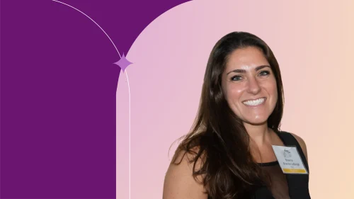 Brianna standing smiling, wearing black shirt