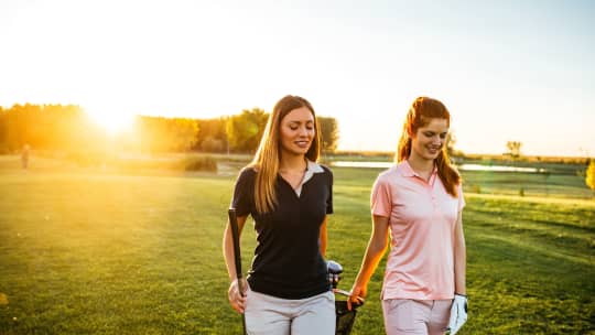 Women golfing