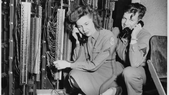 woman and man operating switchboard