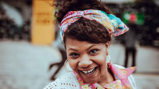 Happy woman with scarf in her hair