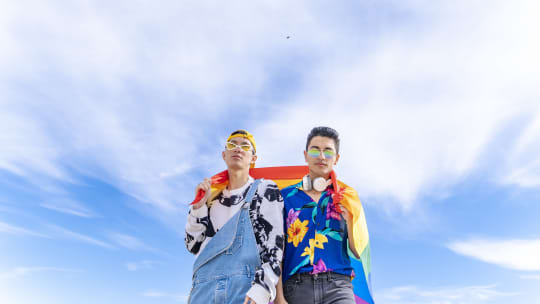 gay couple with pride flag