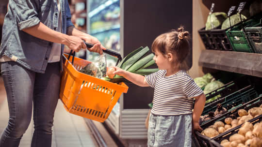 Little girl shopping with her mom
