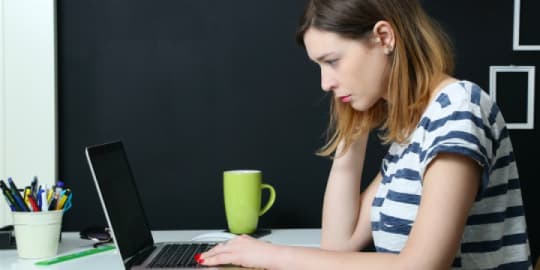 Worried woman on laptop
