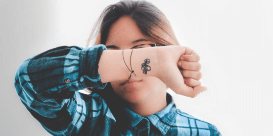 woman with tattoo on her wrist